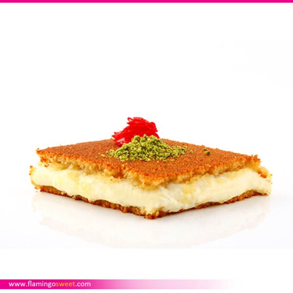 Lebanese knefeh pastry topped with cheese and pistachios.